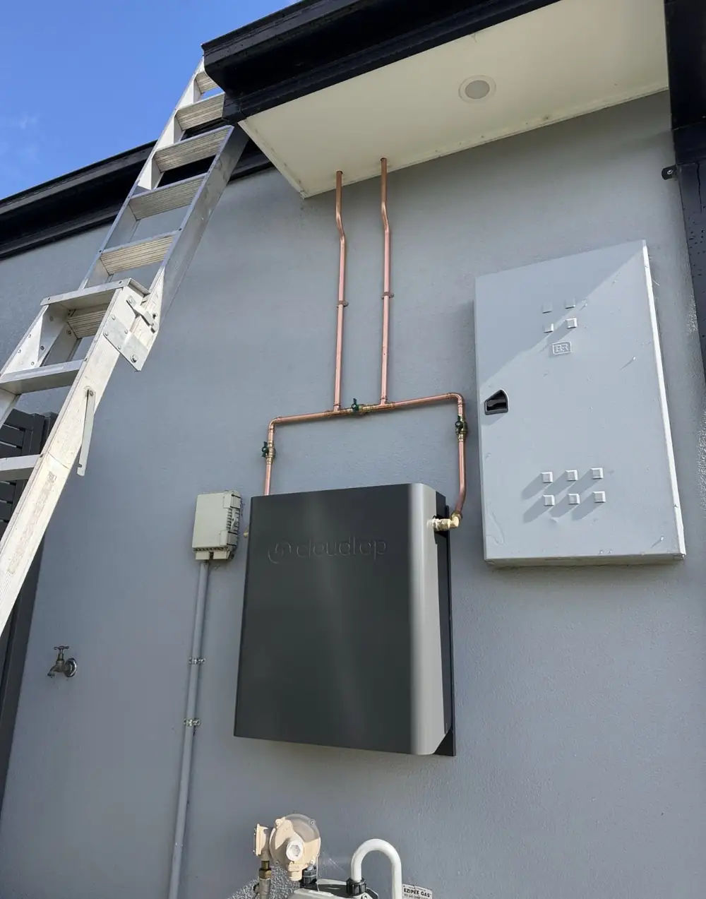 Whole House Filtration unit in Monument, wall mounted under the eave